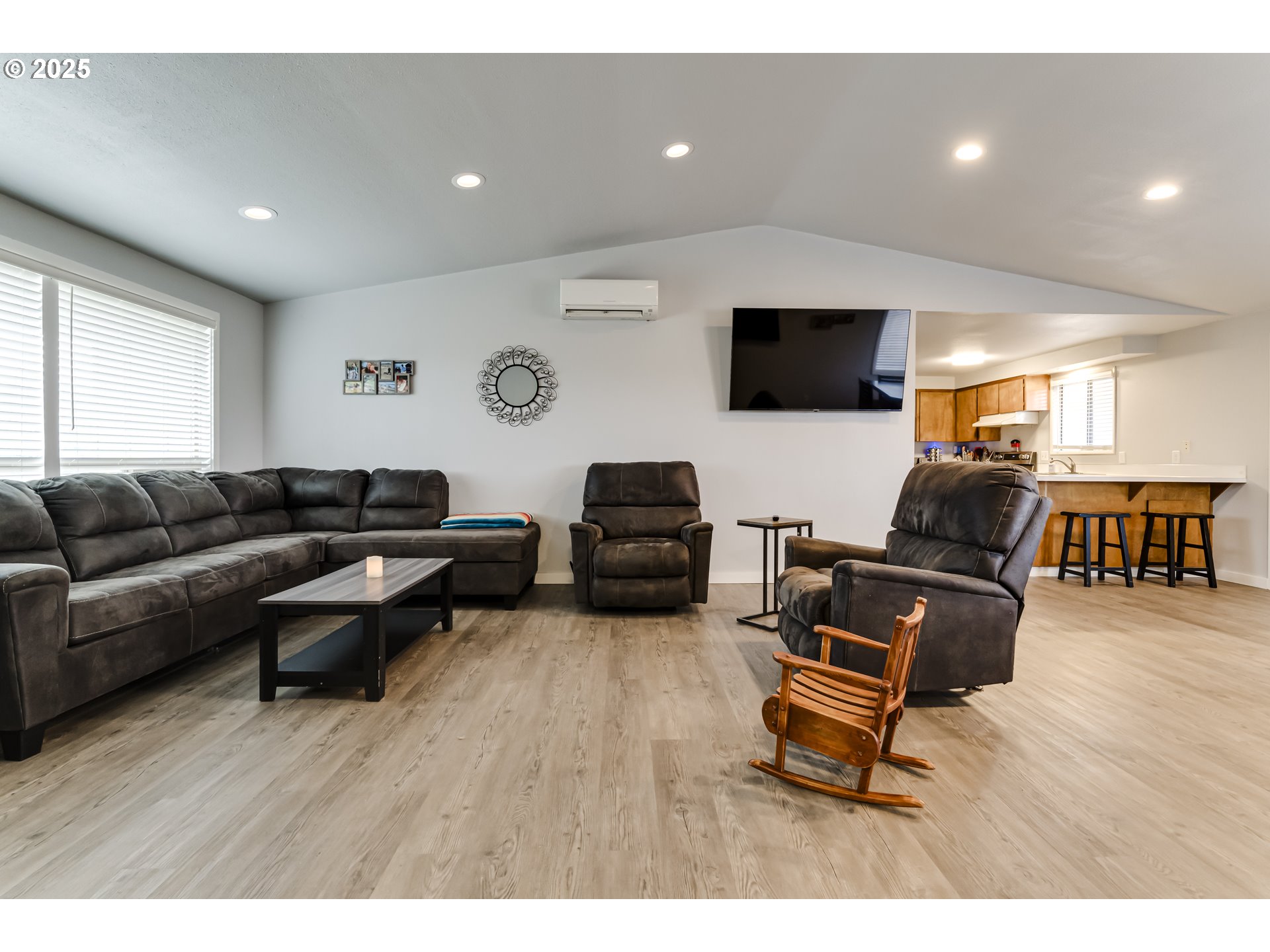 6865 Main Street Springfield, OR 97478 - Photo 6 of 48 a living room with furniture and a flat screen tv