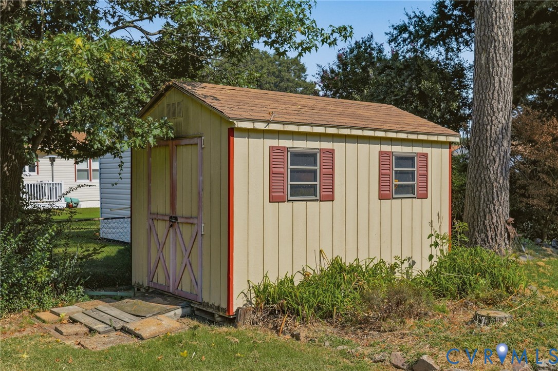 4810 Conduit Road Colonial Heights, VA 23834 - Photo 28 of 29 Detached storage shed with two windows, red decora