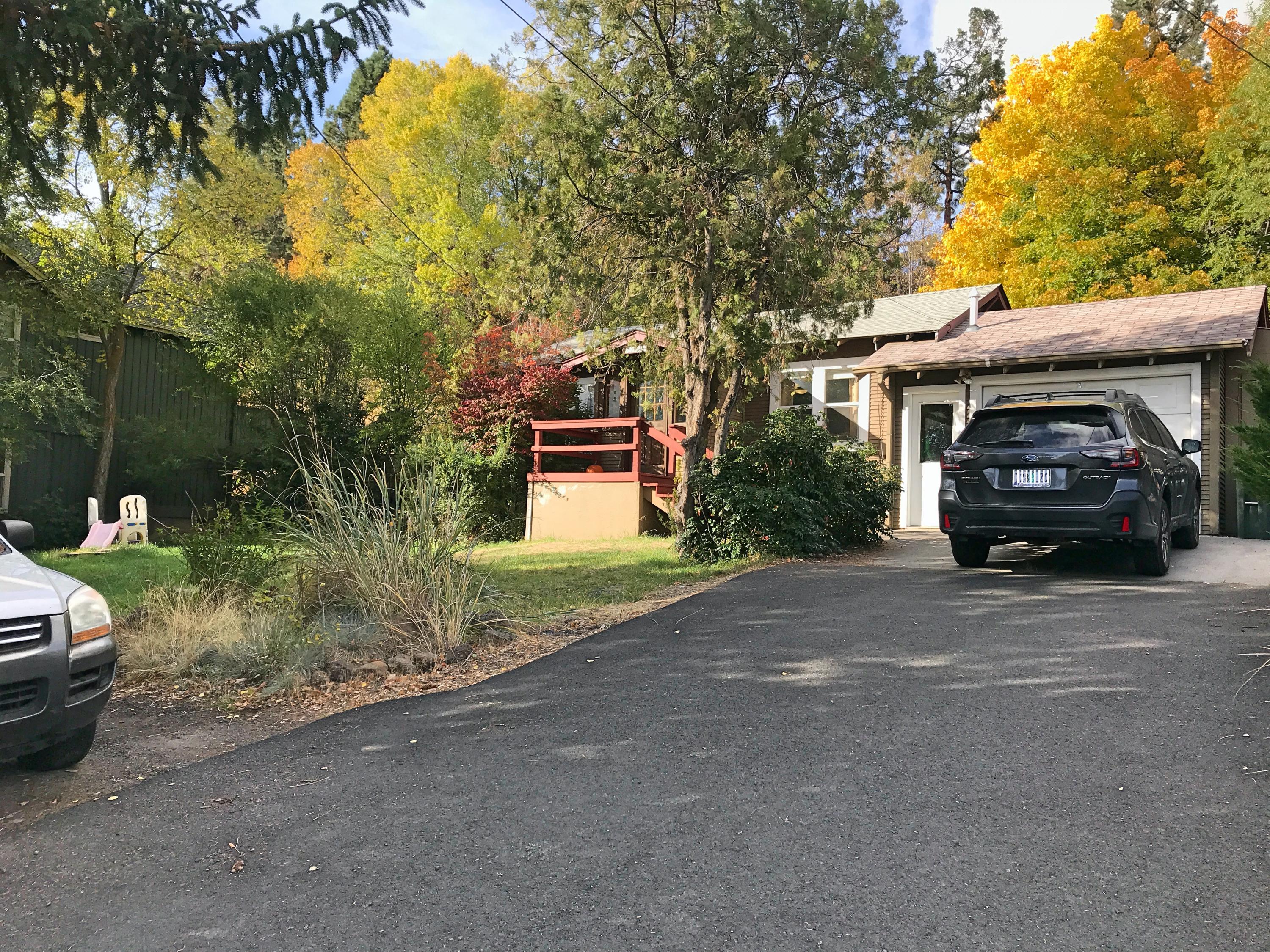 1973 Northwest Awbrey Road Bend, OR 97703 - Photo 2 of 24 a car parked in front of a house