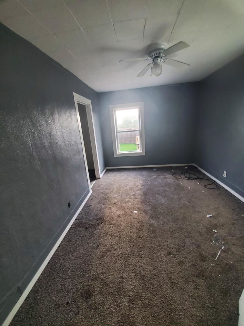 12463 West Haldane Road Forreston, IL 61030 - Photo 3 of 13 an empty room with a empty space and windows