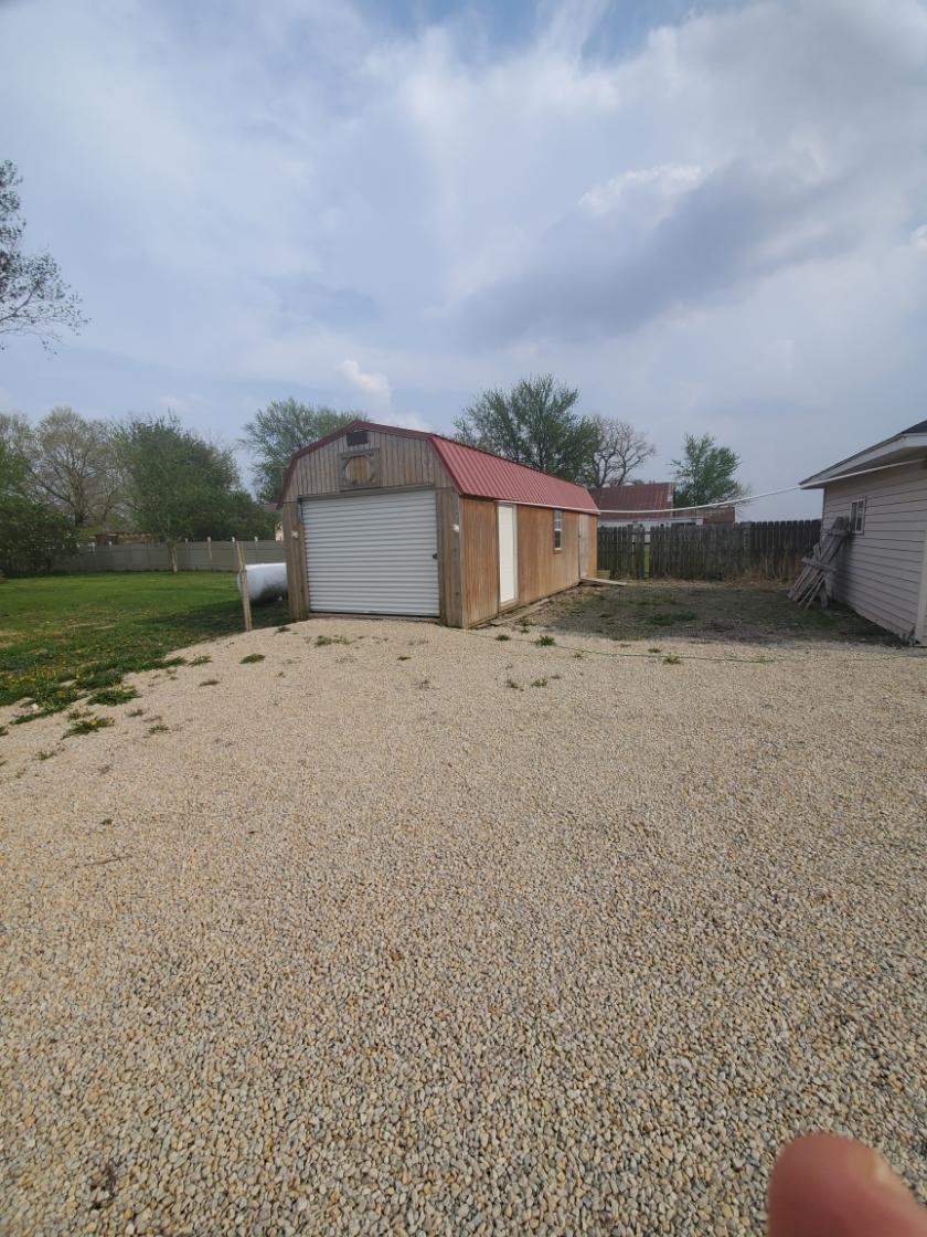 12463 West Haldane Road Forreston, IL 61030 - Photo 5 of 13 a backyard of a house with lots of green space and fog