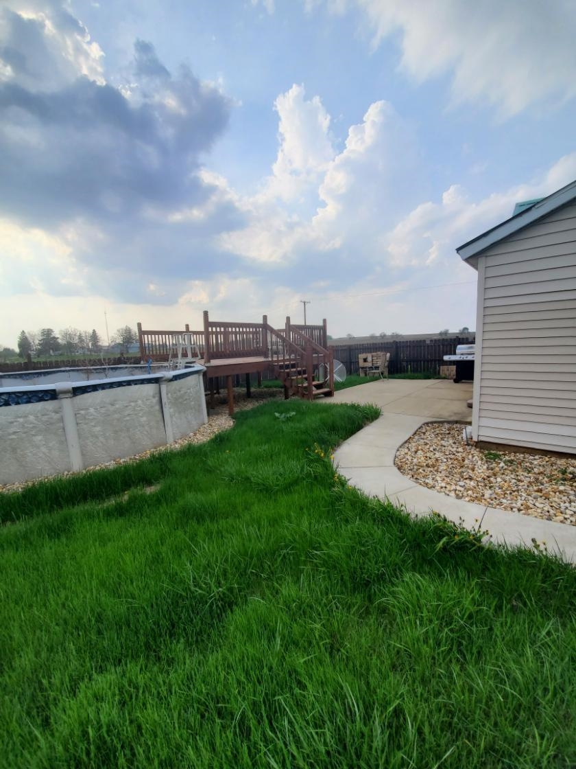 12463 West Haldane Road Forreston, IL 61030 - Photo 10 of 13 a view of a backyard with plants and lake