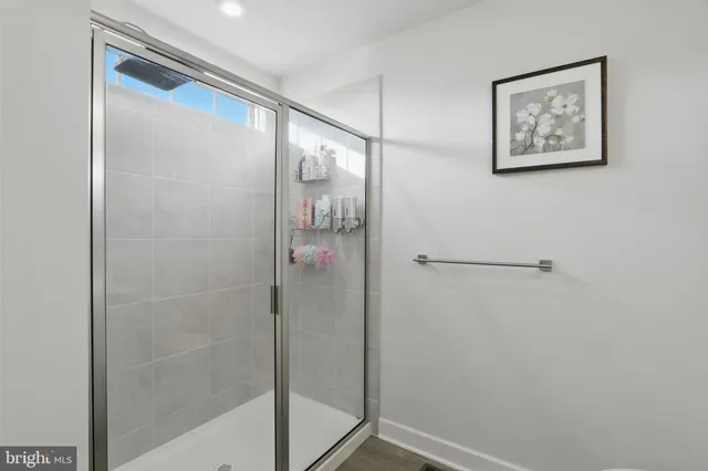 a bathroom with a glass shower door