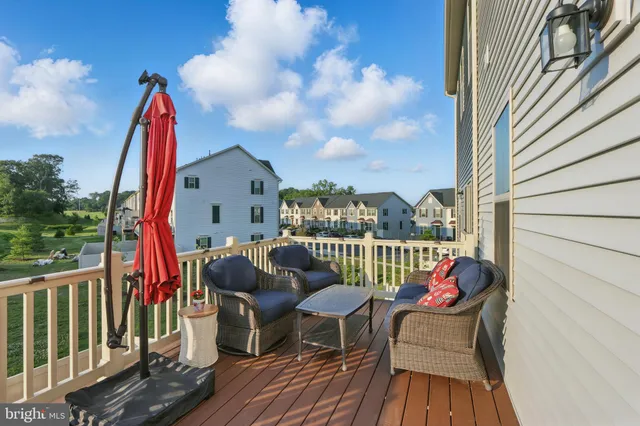 a view of a two chairs and table in the balcony