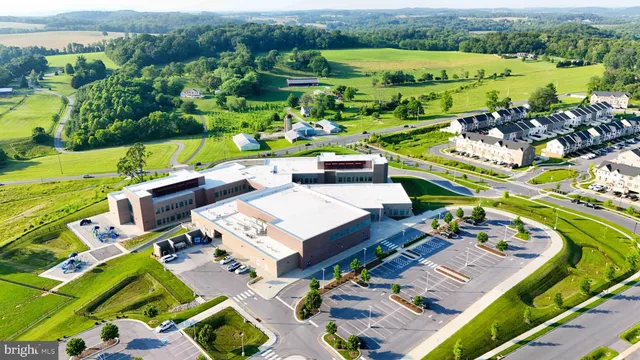 an aerial view of a house with outdoor space