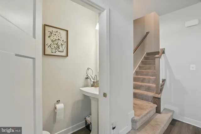 a view of staircase with white walls