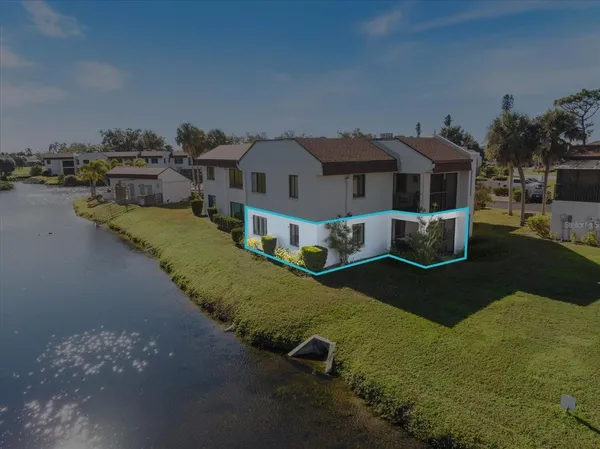 a aerial view of a house with a yard