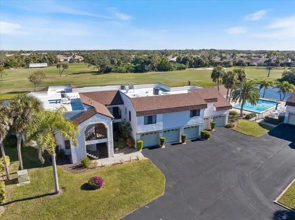 an aerial view of a house with outdoor space