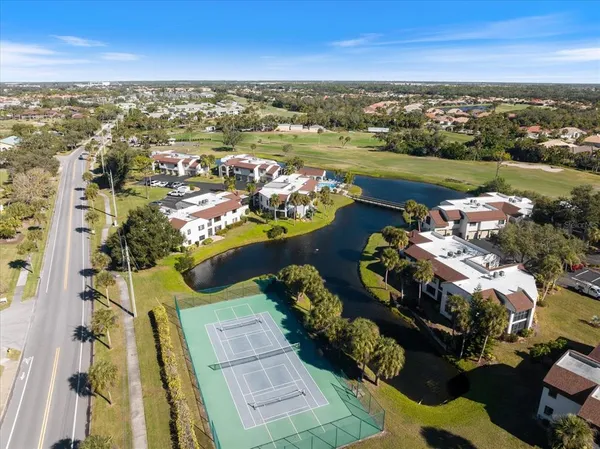 an aerial view of residential houses with outdoor space