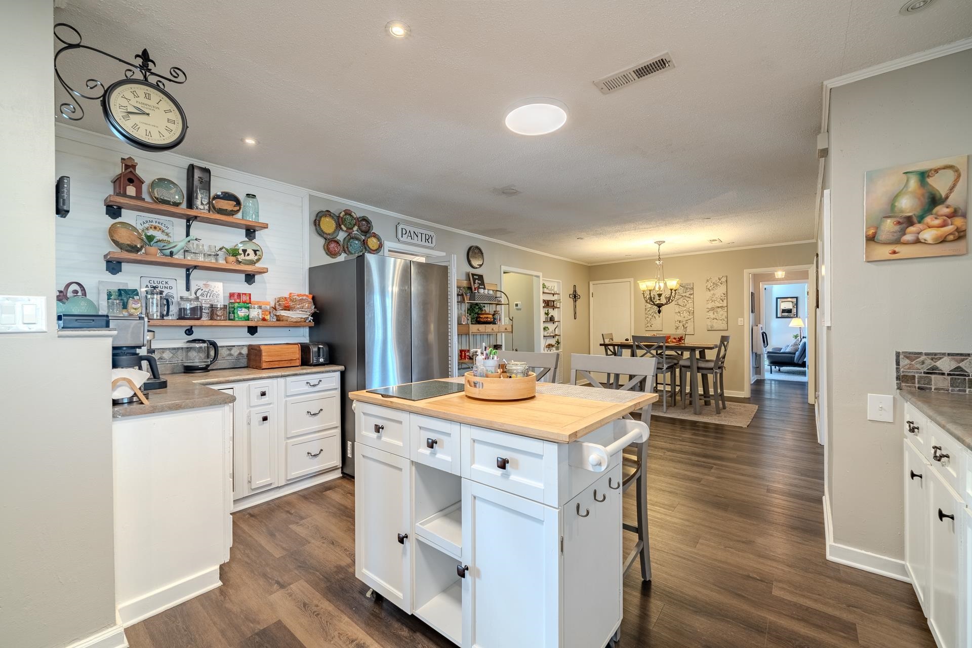 865 Pickett Road Stantonville, TN 38379 - Photo 14 of 40 a kitchen with stainless steel appliances kitchen island granite countertop a sink and cabinets