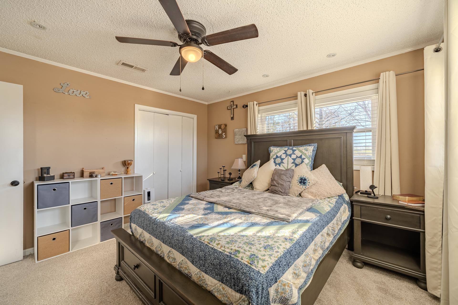 865 Pickett Road Stantonville, TN 38379 - Photo 23 of 40 a bedroom with a bed and a chandelier