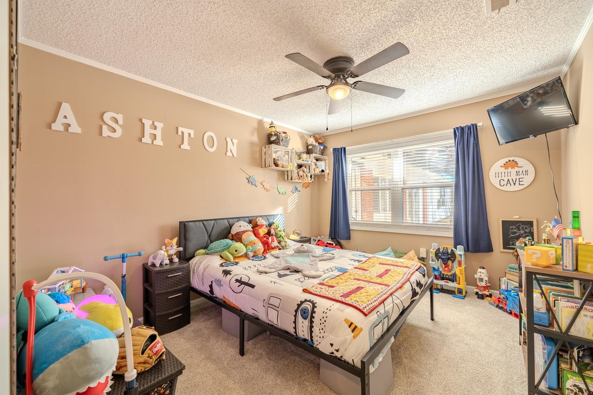 865 Pickett Road Stantonville, TN 38379 - Photo 27 of 40 a bedroom with a bed and a chandelier