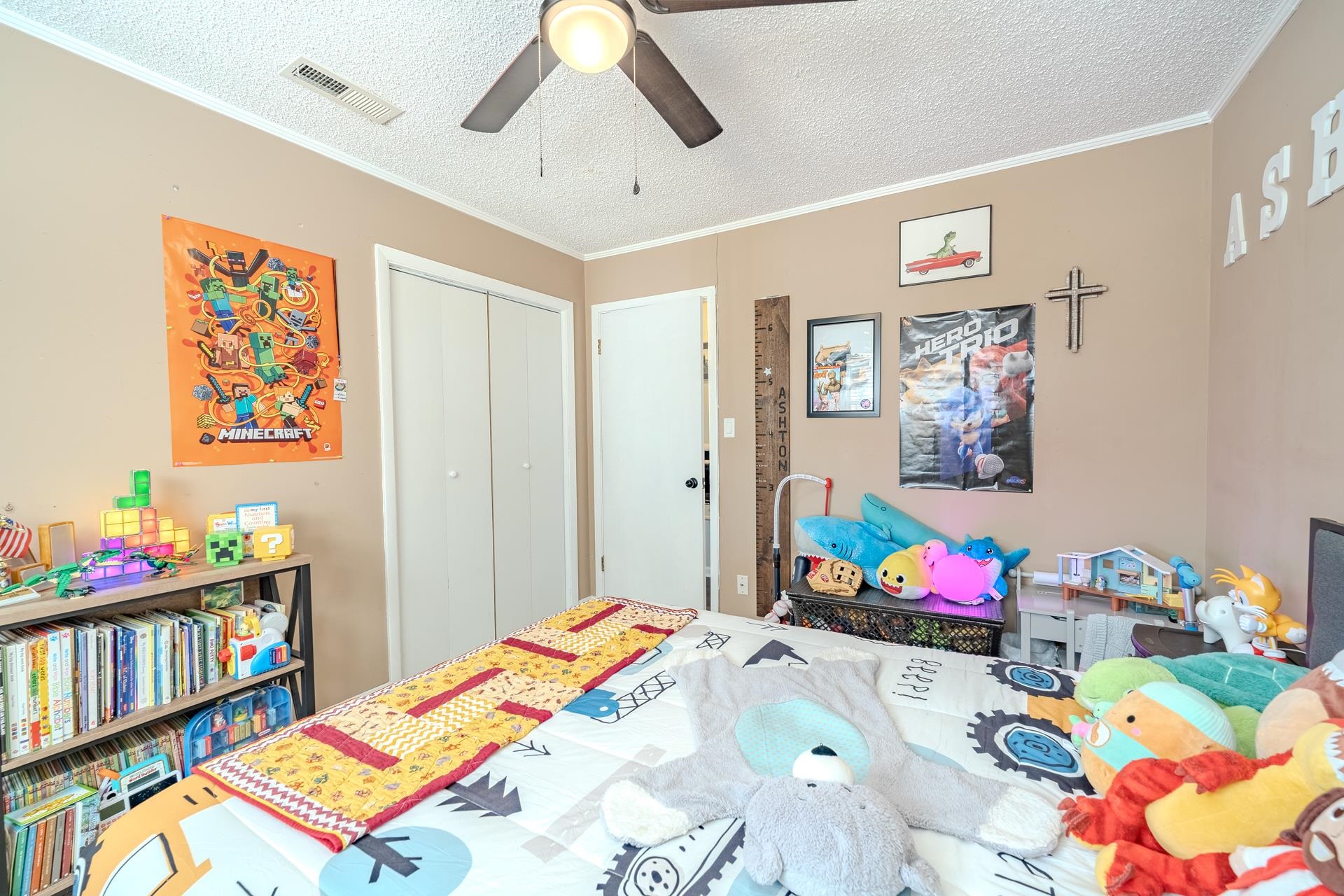 865 Pickett Road Stantonville, TN 38379 - Photo 28 of 40 Bedroom featuring a textured ceiling, ornamental molding, ceiling fan, and a closet