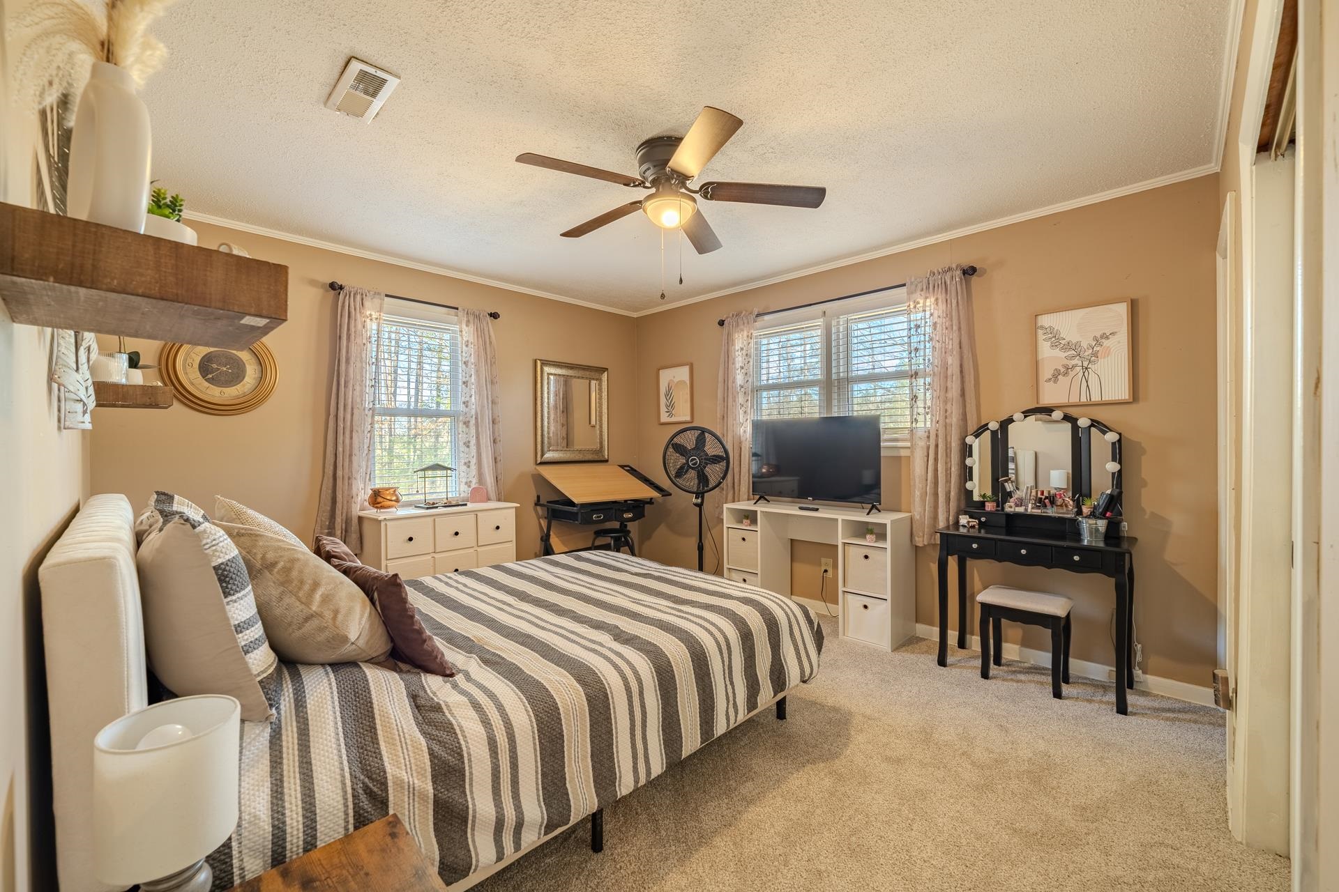 865 Pickett Road Stantonville, TN 38379 - Photo 30 of 40 a bedroom with a bed and a flat screen tv