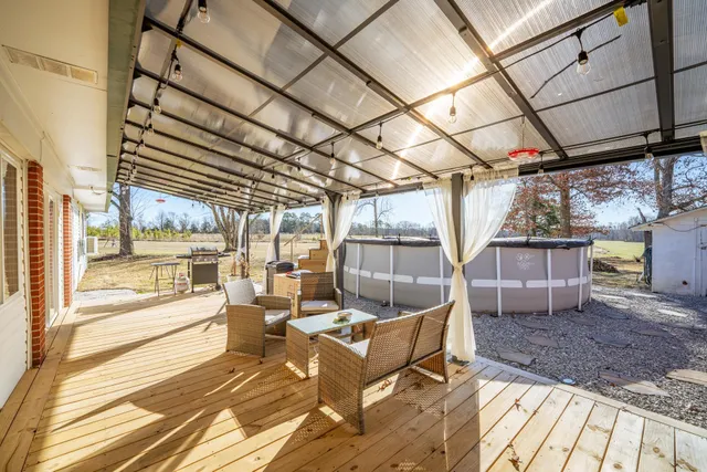 a view of a chairs and table in the patio