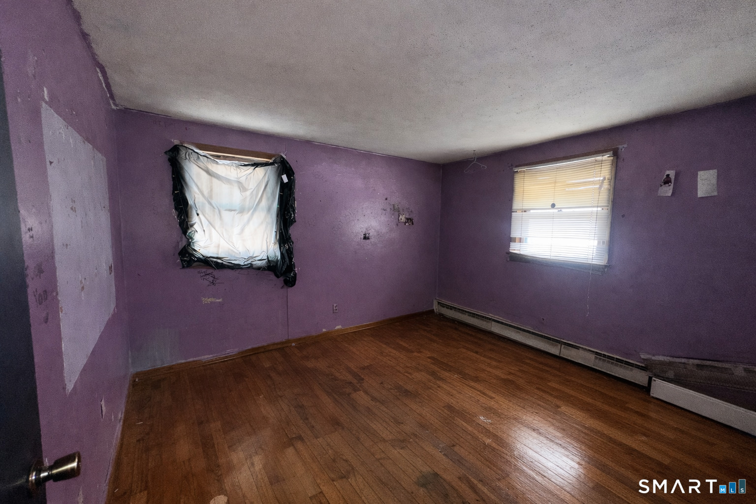 a view of an empty room and window