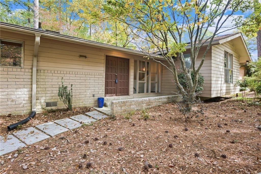 705 Edgewater Trail Sandy Springs, GA 30328 - Photo 2 of 36 a backyard of a house with barbeque oven