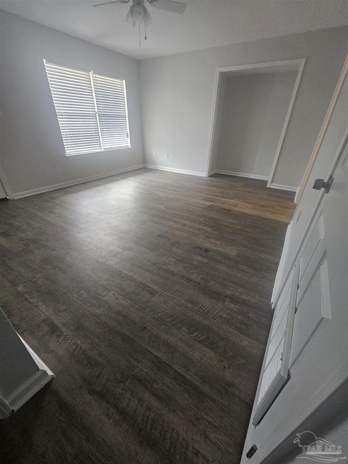 751 Tumbleweed Trail, Unit A Pensacola, FL 32534 - Photo 13 of 13 a view of room with window and hardwood floor