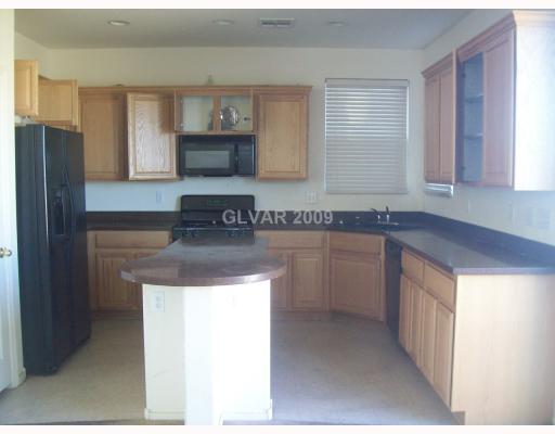9032 Rutherford Grove Street Las Vegas, NV 89148 - Photo 3 of 8 Kitchen.