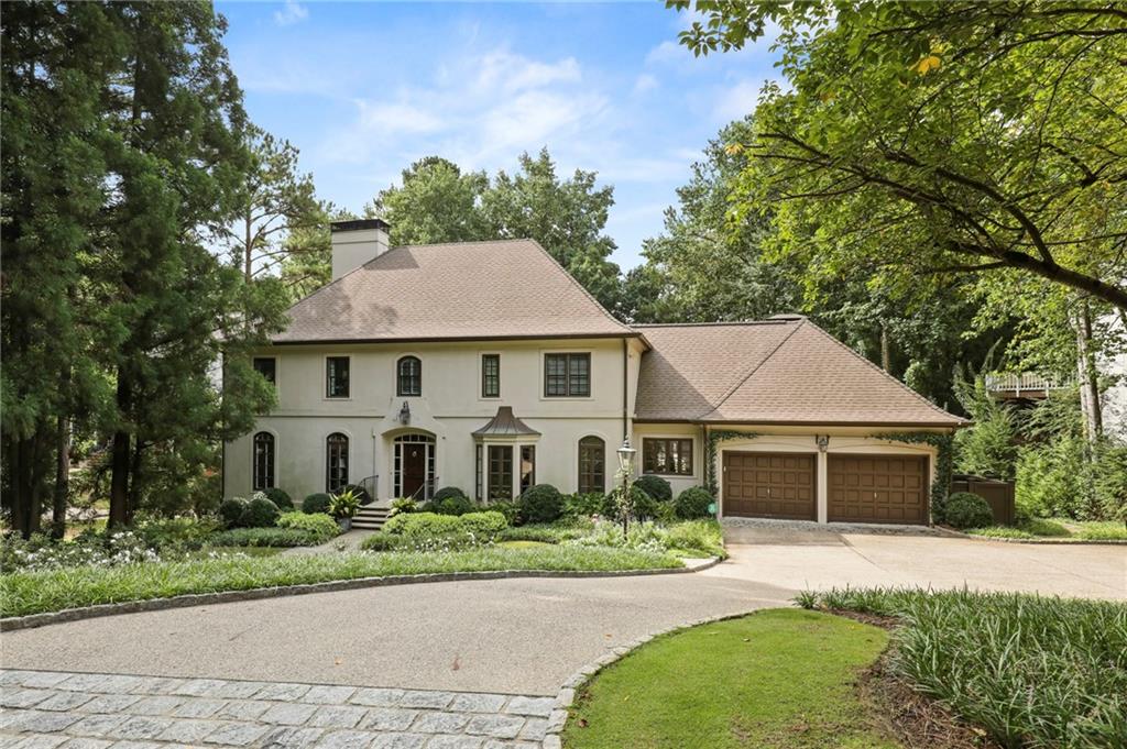 2817 Dover Road Northwest Atlanta, GA 30327 - Photo 1 of 1 Cobblestone apron leads to new driveway with 2 guest parking spaces