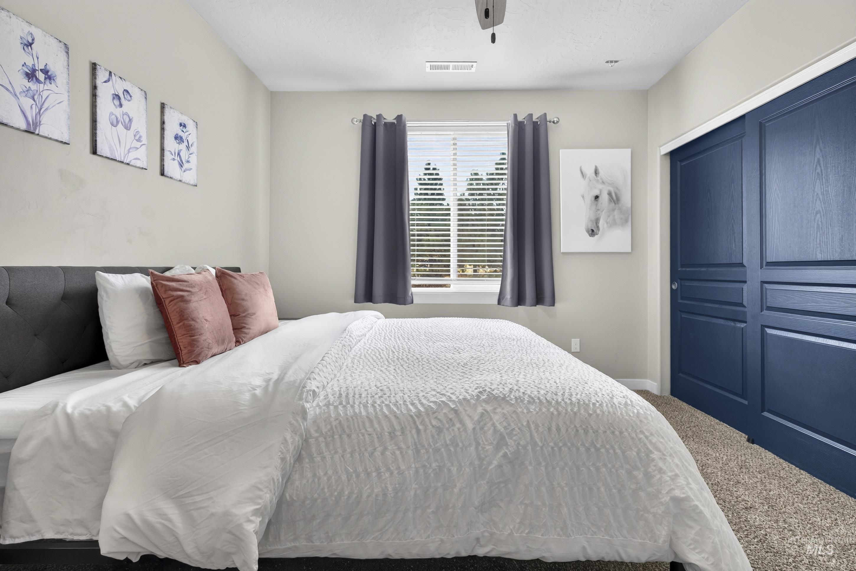 132 Mores Creek Rim Road Boise, ID 83716 - Photo 29 of 44 Window with blinds and drapes, ceiling fan, recessed lighting, and blue sliding closet doors