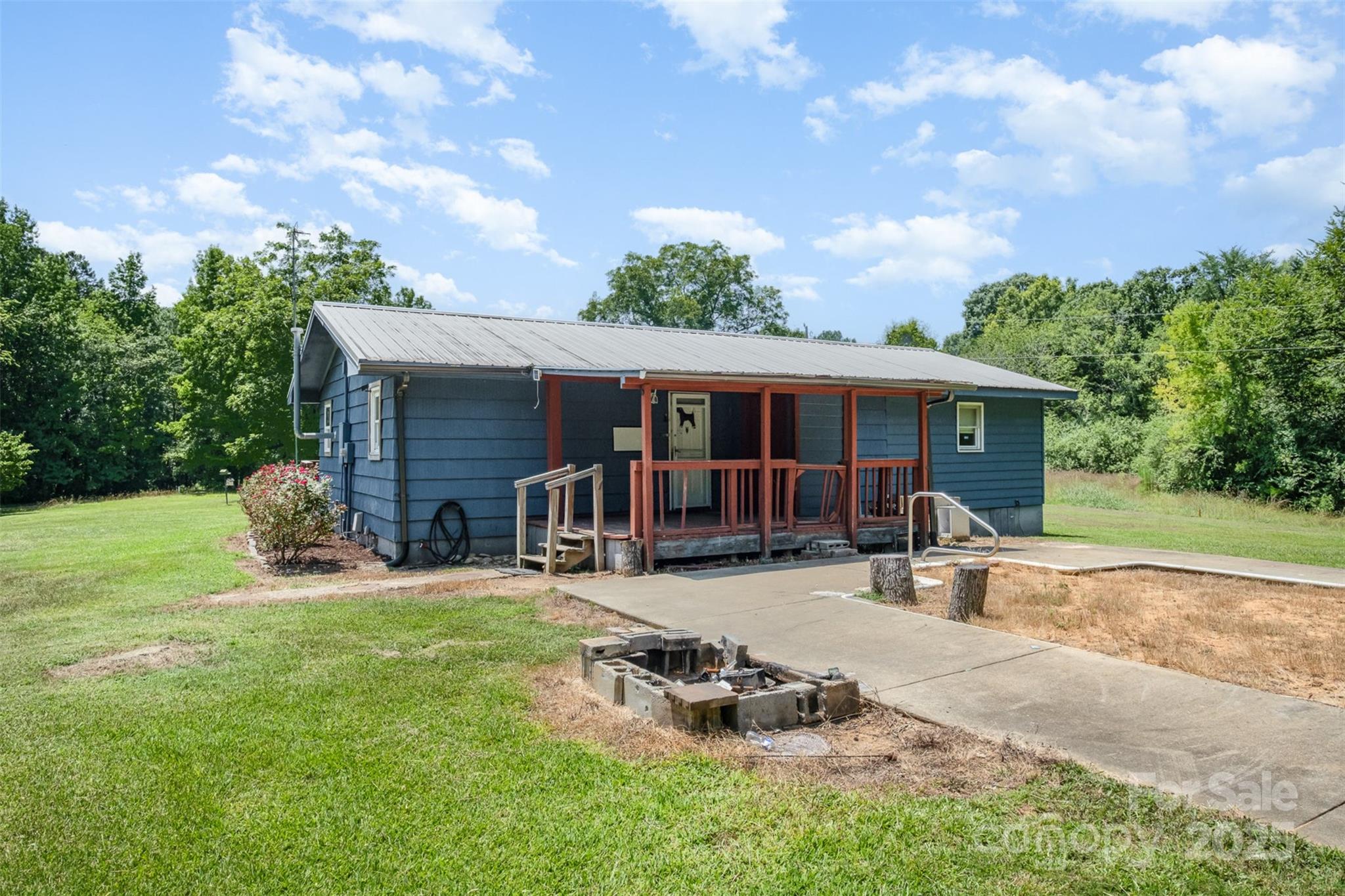 1043 Sid Davis Road Chester, SC 29706 - Photo 20 of 25 front view of a house with a yard patio and a garden