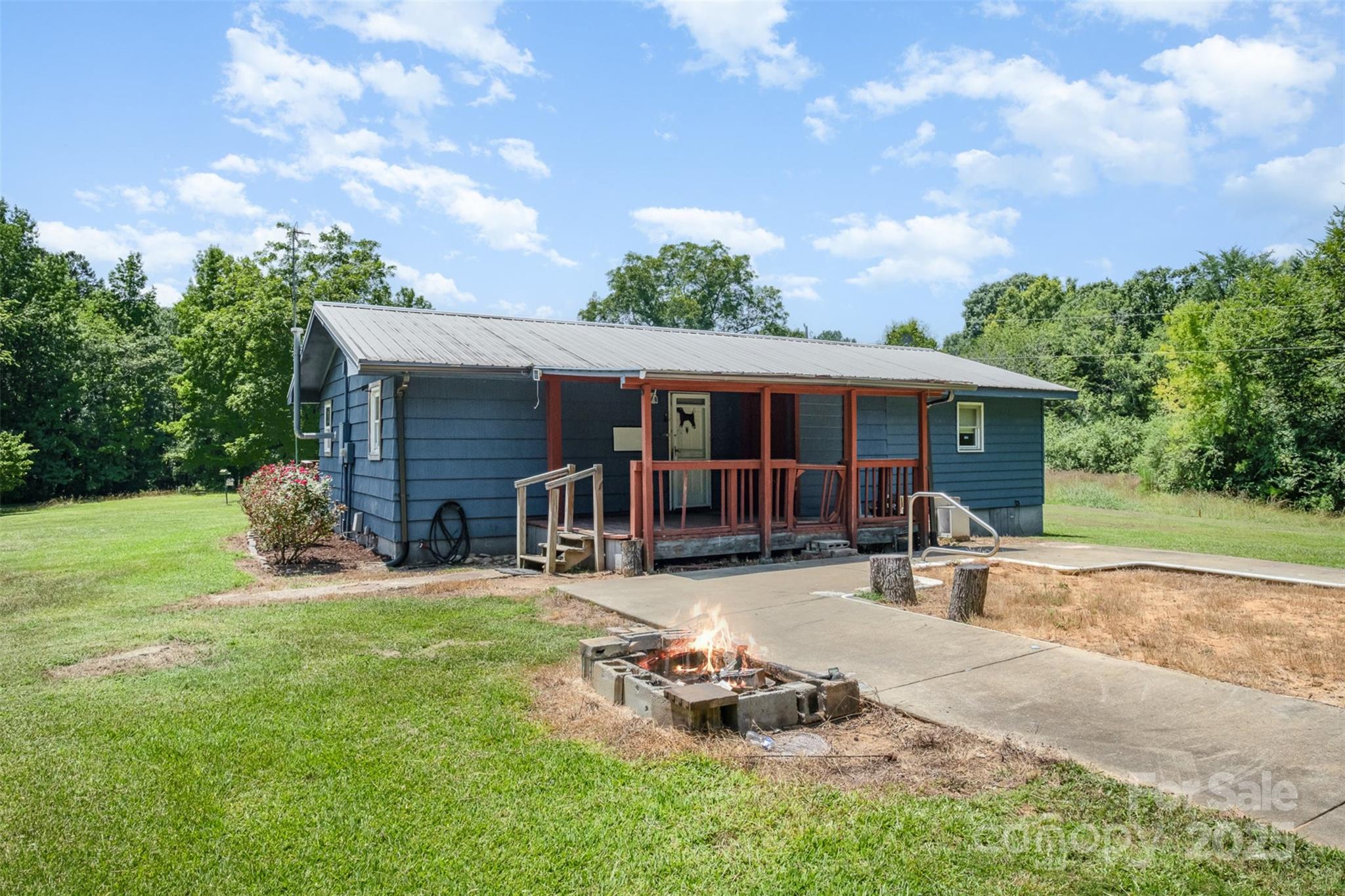 1043 Sid Davis Road Chester, SC 29706 - Photo 21 of 25 a view of a house with backyard porch and sitting area