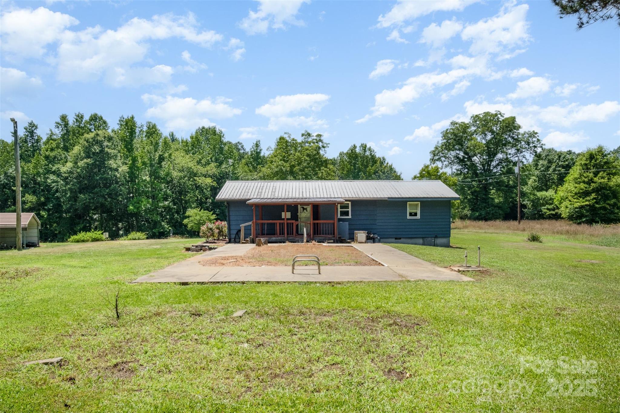 1043 Sid Davis Road Chester, SC 29706 - Photo 22 of 25 a view of a house with pool and a yard