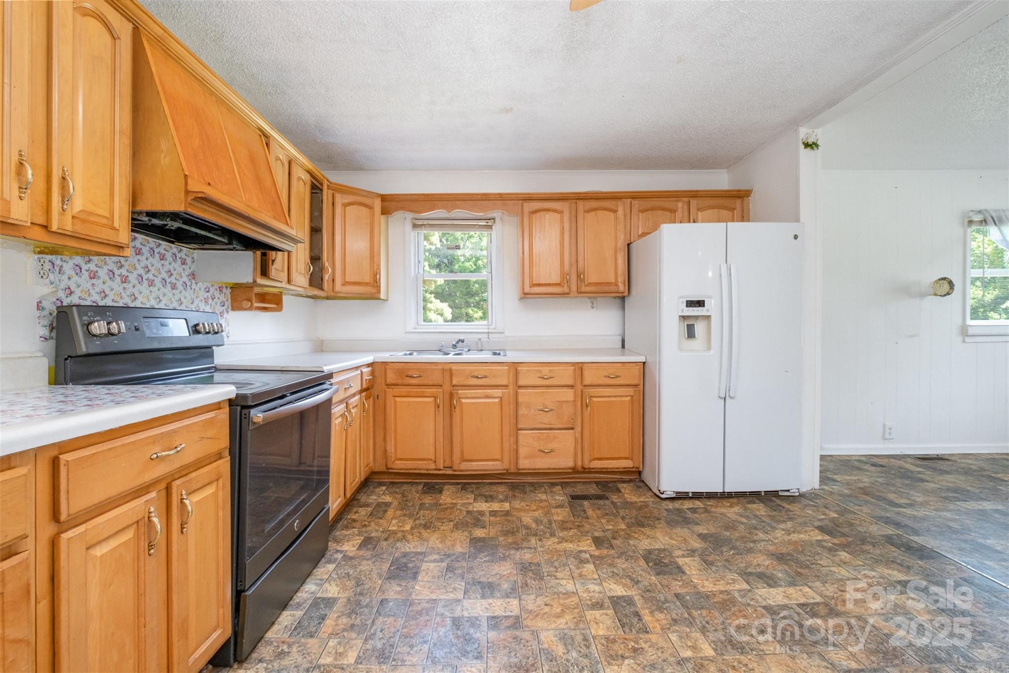 1043 Sid Davis Road Chester, SC 29706 - Photo 8 of 25 a kitchen with a refrigerator and a sink