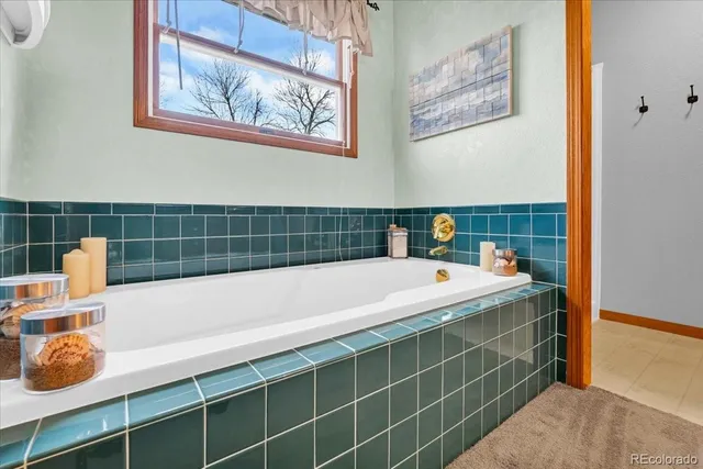 a bathroom with a bathtub and shower