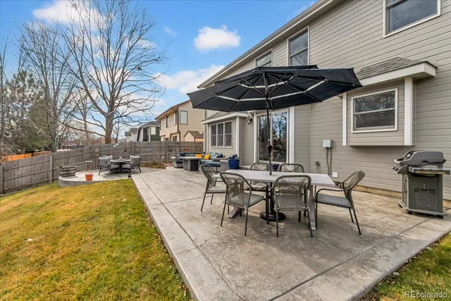a view of a patio with swimming pool table and chairs