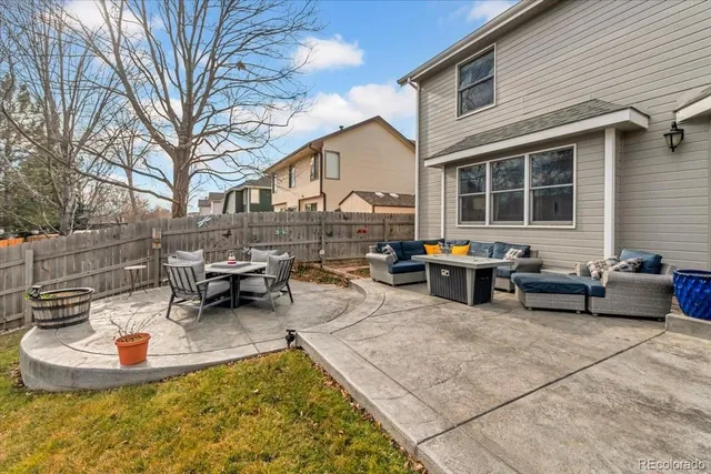 a view of a patio with chairs and tables