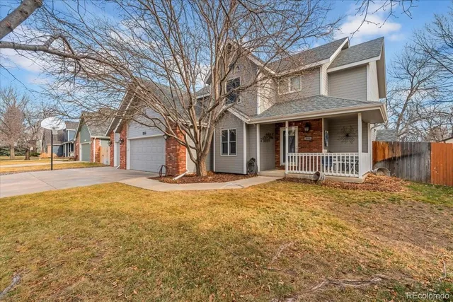 a house that has a tree in front of it