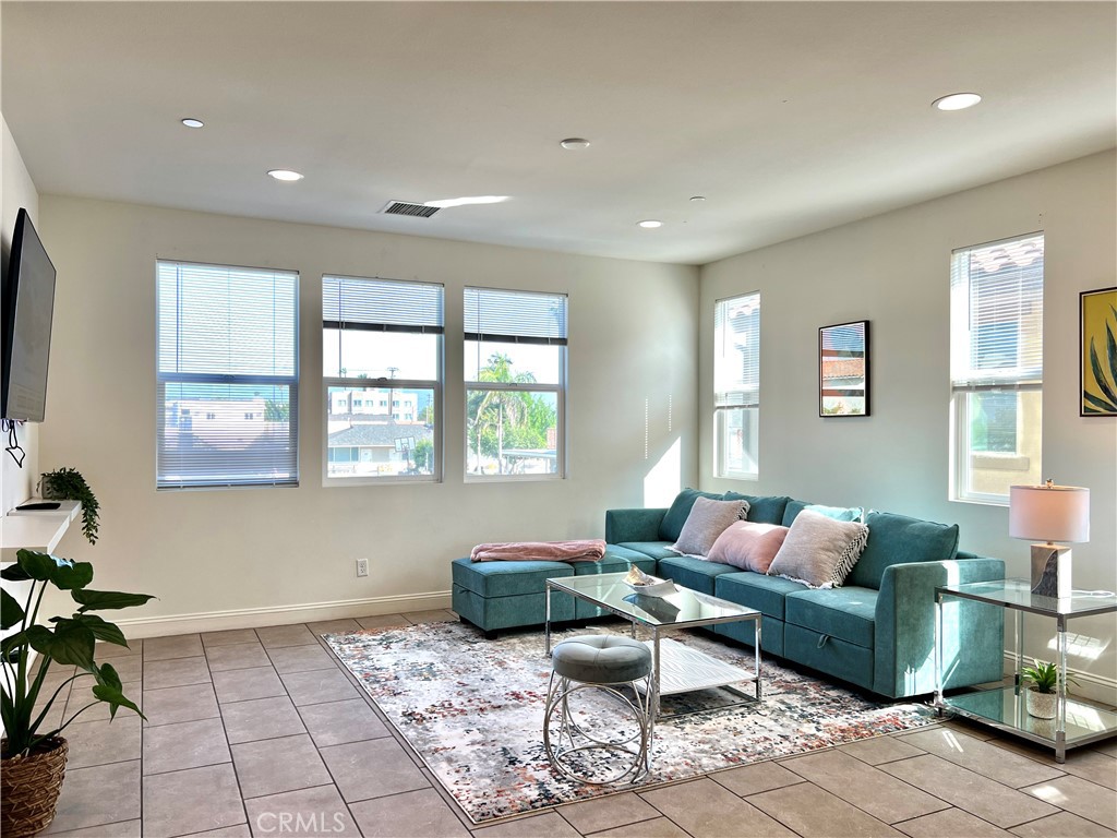 1207 Alpine Circle Baldwin Park, CA 91706 - Photo 13 of 38 a living room with furniture and a window