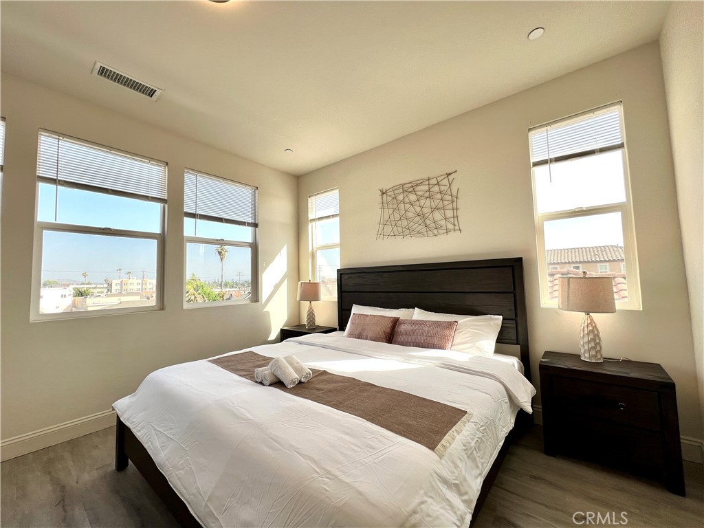 1207 Alpine Circle Baldwin Park, CA 91706 - Photo 19 of 38 a bedroom with a large bed and a window