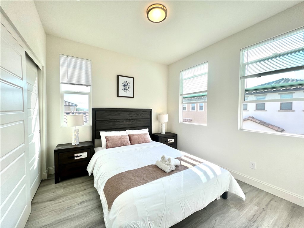 1207 Alpine Circle Baldwin Park, CA 91706 - Photo 24 of 38 a bedroom with a bed and wooden floor