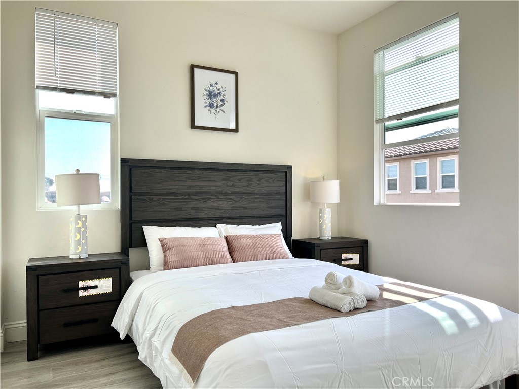 1207 Alpine Circle Baldwin Park, CA 91706 - Photo 30 of 38 a bedroom with a bed and wooden floor