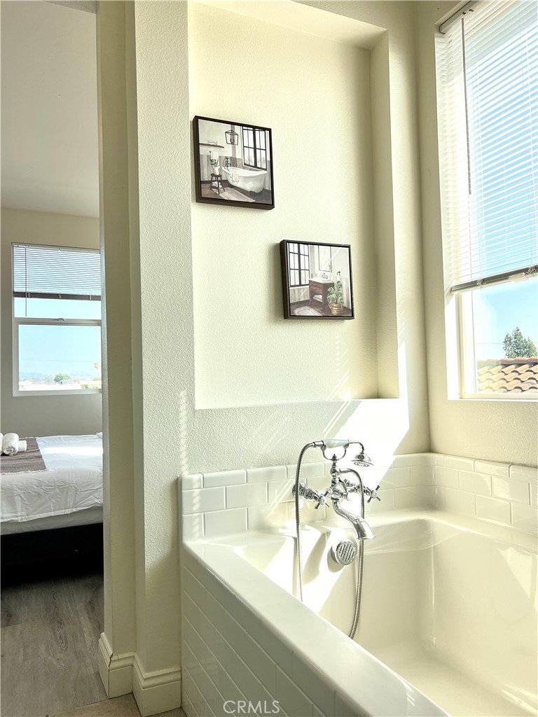 1207 Alpine Circle Baldwin Park, CA 91706 - Photo 31 of 38 a bathroom with a bathtub and a sink