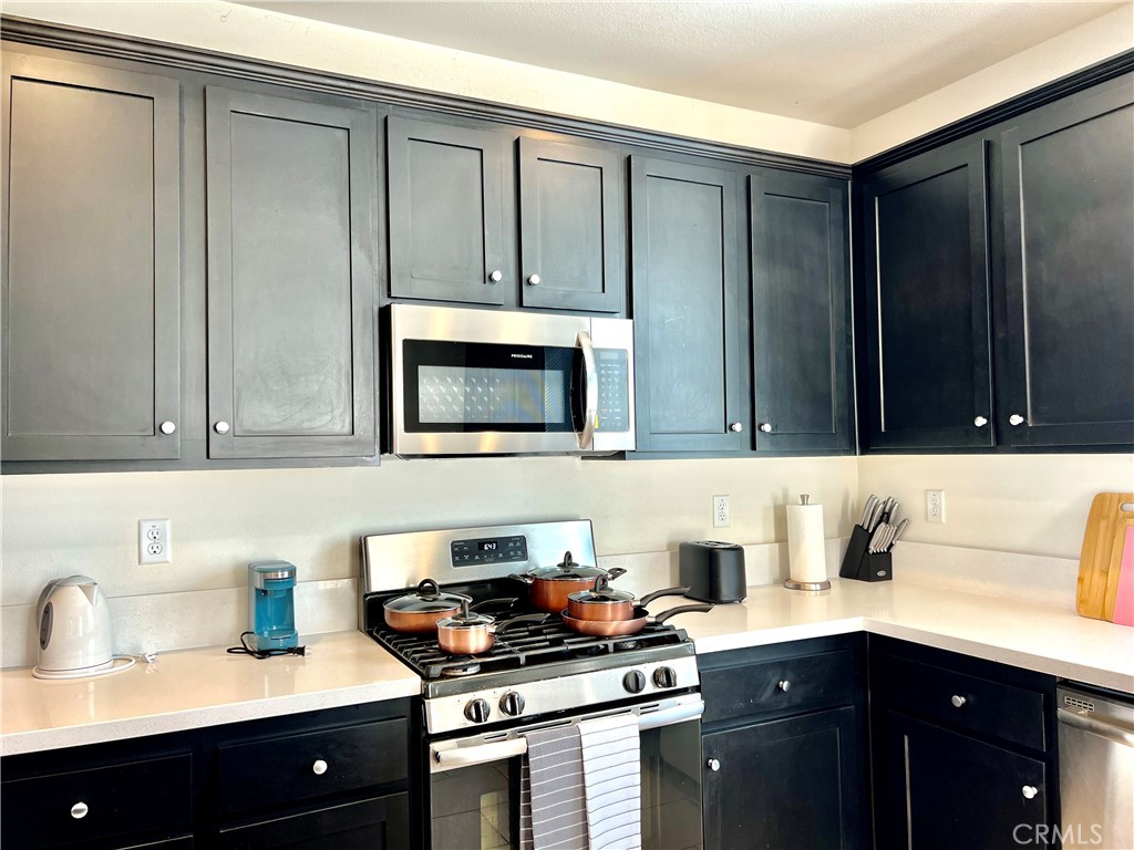 1207 Alpine Circle Baldwin Park, CA 91706 - Photo 5 of 38 a kitchen with a sink and cabinets