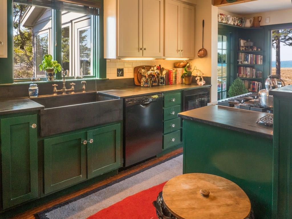 73 Lopaus Point Road Bernard, ME 04612 - Photo 7 of 33 The kitchen features black slate...
