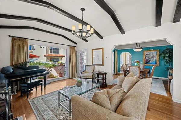 a kitchen with stainless steel appliances kitchen island granite countertop a refrigerator stove and sink