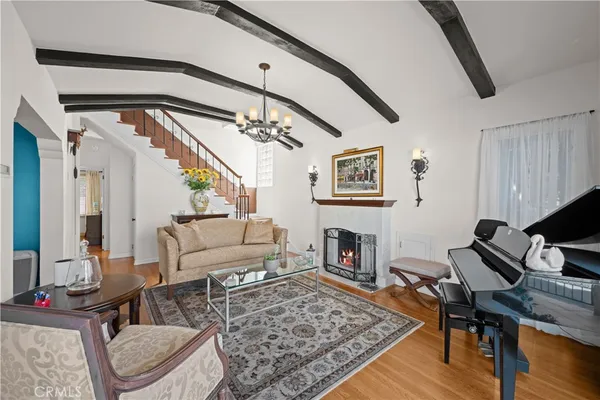 a dining room with furniture and a window