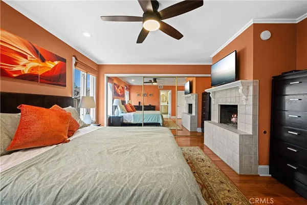 a bathroom with a granite countertop toilet sink and mirror