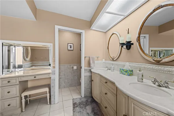 a view of a hallway with wooden floor and windows