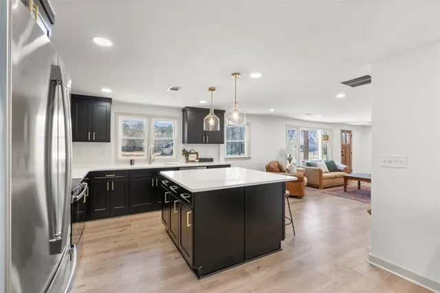 a kitchen with a sink and cabinets