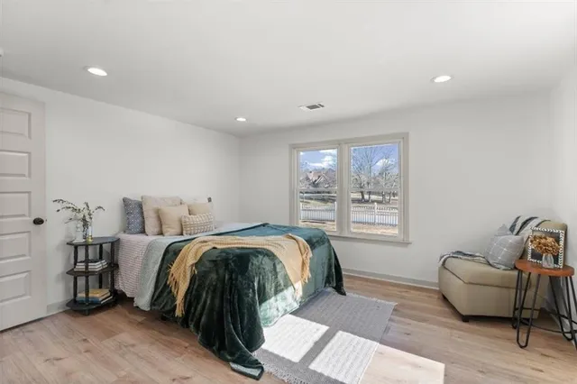 a bed room with a bed and a couch