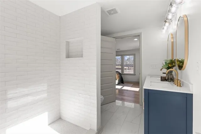 a bathroom with a sink and a mirror