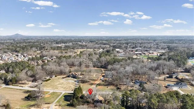 a picture of a bathroom with a white wall with a picture of a picture