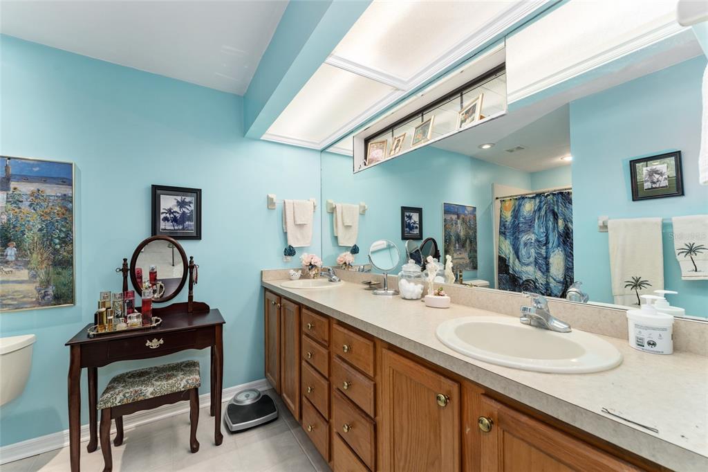 10922 Palmetto Boulevard Alachua, FL 32615 - Photo 20 of 51 a bathroom with a sink and a mirror