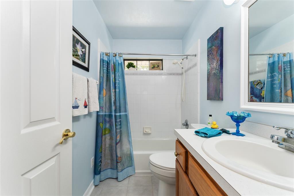 10922 Palmetto Boulevard Alachua, FL 32615 - Photo 26 of 51 a bathroom with a sink toilet and shower
